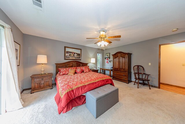 50365 Spook Ln, Oakhurst, CA 93644 - bedroom with a ceiling fan, light carpet, baseboards, and visible vents
