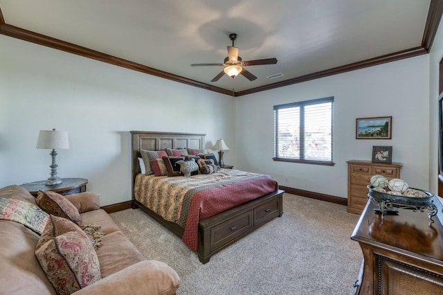 carpeted bedroom with ceiling fan and ornamental molding