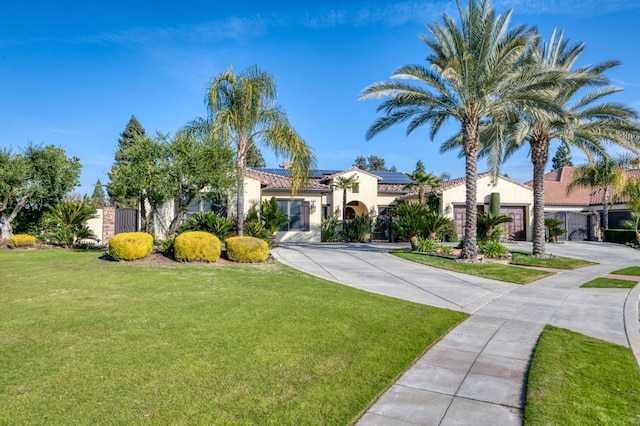 mediterranean / spanish-style home featuring a front yard