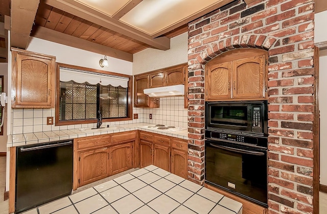 kitchen with tile countertops, decorative backsplash, light tile patterned flooring, and black appliances