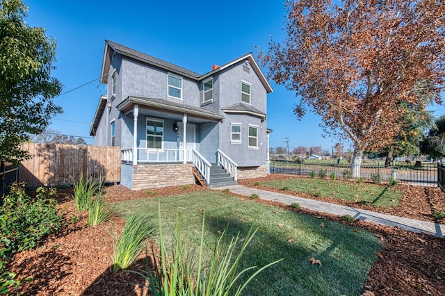 view of front of property with a front lawn and a porch