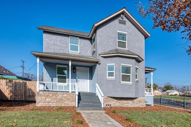 view of front of home featuring a porch and a front lawn