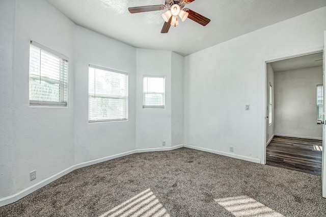 spare room with carpet flooring, a textured ceiling, and ceiling fan