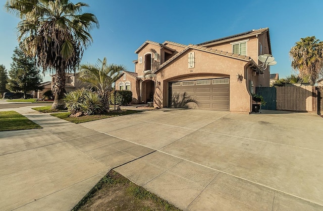 mediterranean / spanish-style house featuring a garage