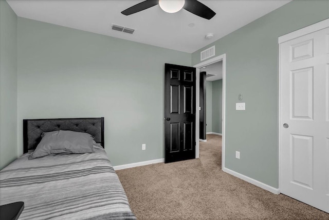 carpeted bedroom featuring ceiling fan