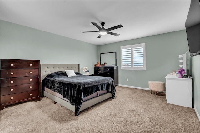 bedroom featuring light carpet and ceiling fan