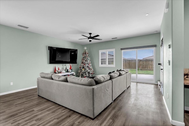 living room with ceiling fan and hardwood / wood-style floors