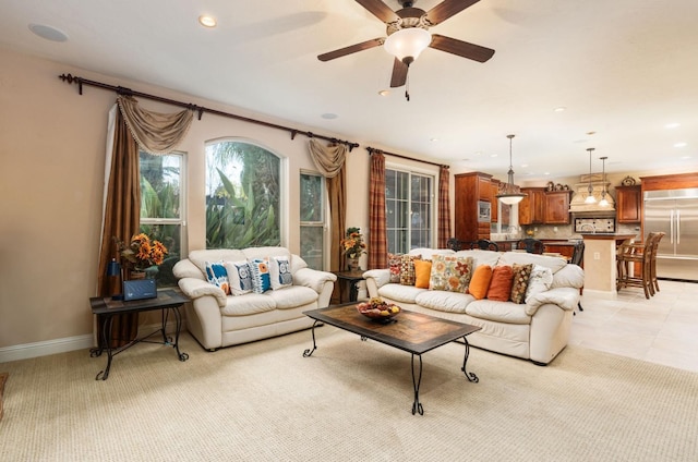 1445 E Via Roma Dr, Fresno, CA 93730 - living area with a ceiling fan, recessed lighting, light carpet, and baseboards