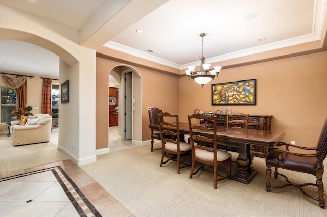 1445 E Via Roma Dr, Fresno, CA 93730 - dining room with arched walkways, light tile patterned floors, a chandelier, recessed lighting, and baseboards