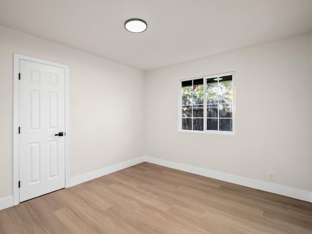 spare room with light wood-type flooring