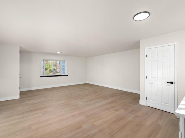 empty room with light hardwood / wood-style floors