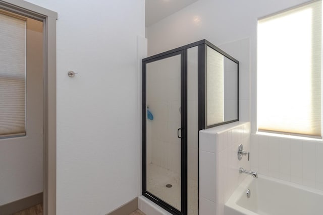 bathroom featuring plus walk in shower