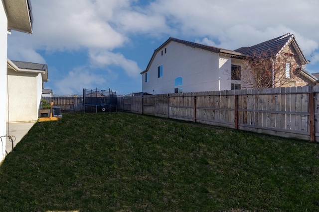 view of yard with a trampoline