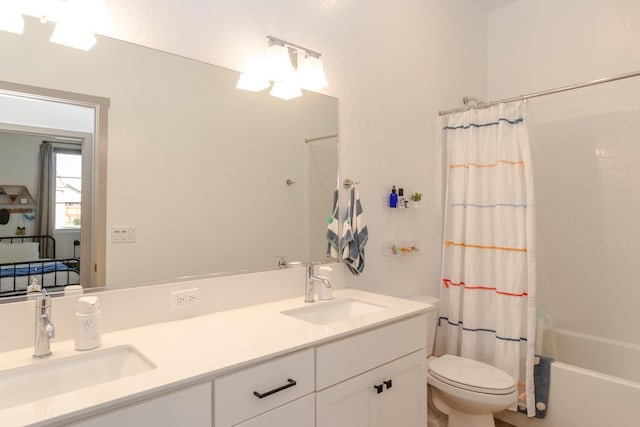 full bathroom with vanity, shower / bathtub combination with curtain, and toilet