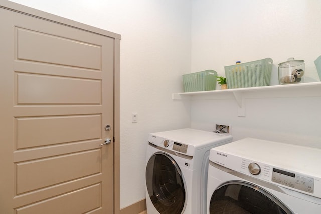 laundry area with independent washer and dryer