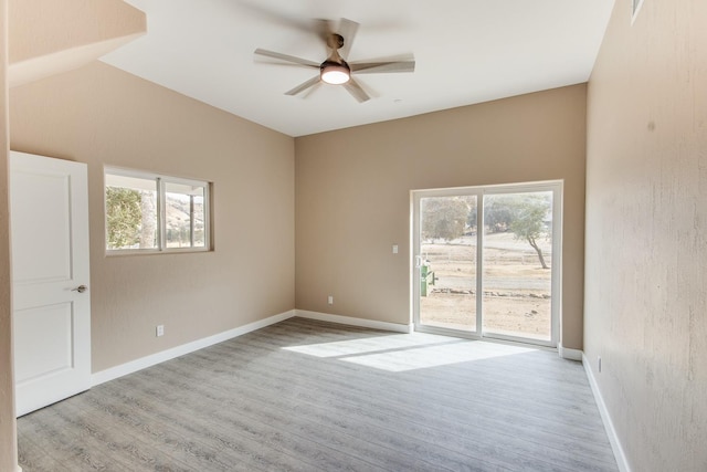 empty room featuring ceiling fan and light wood-type flooring