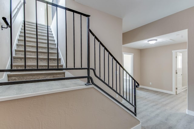 stairs with hardwood / wood-style floors