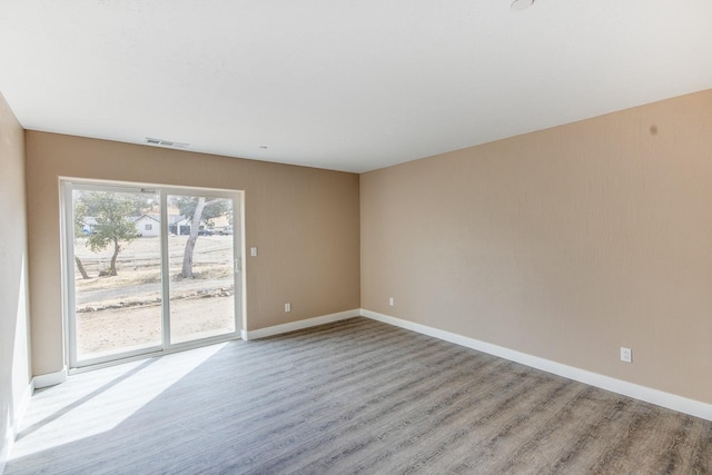 unfurnished room featuring light wood-type flooring