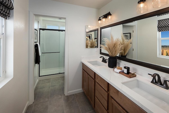 bathroom featuring vanity, tile patterned floors, and walk in shower