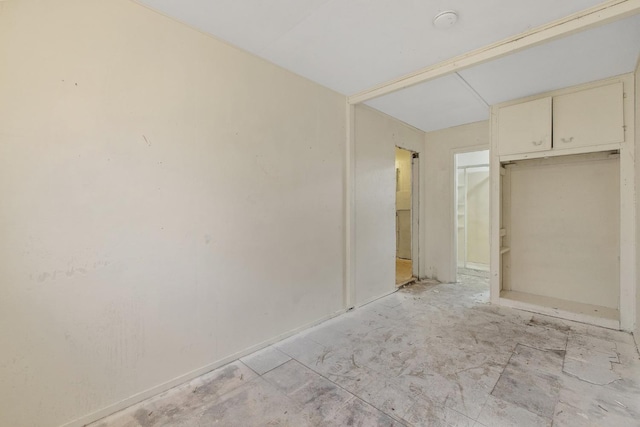 unfurnished bedroom featuring a closet