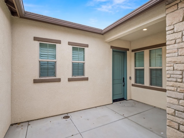 doorway to property featuring a patio