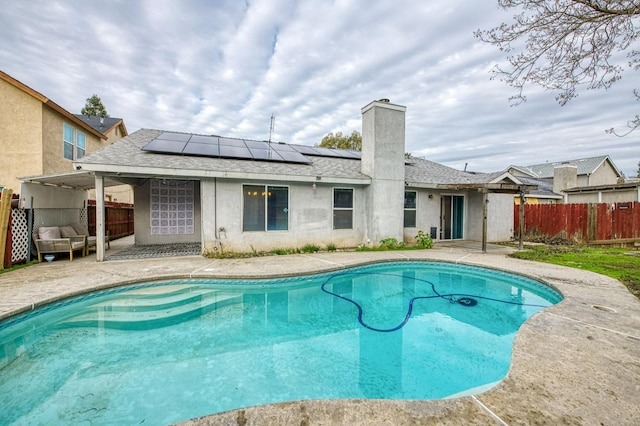 view of pool with outdoor lounge area and a patio