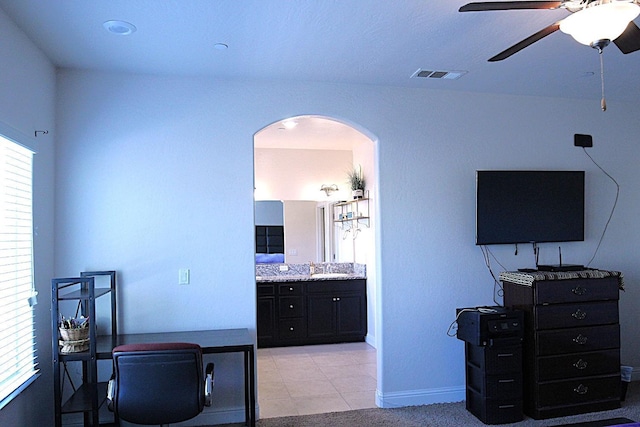 office space with ceiling fan and sink