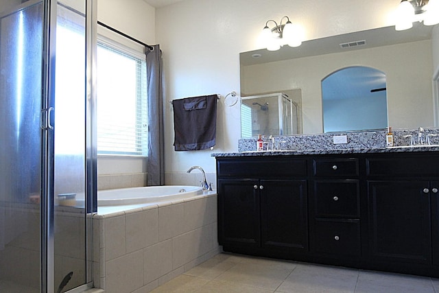 bathroom featuring vanity, separate shower and tub, and tile patterned floors