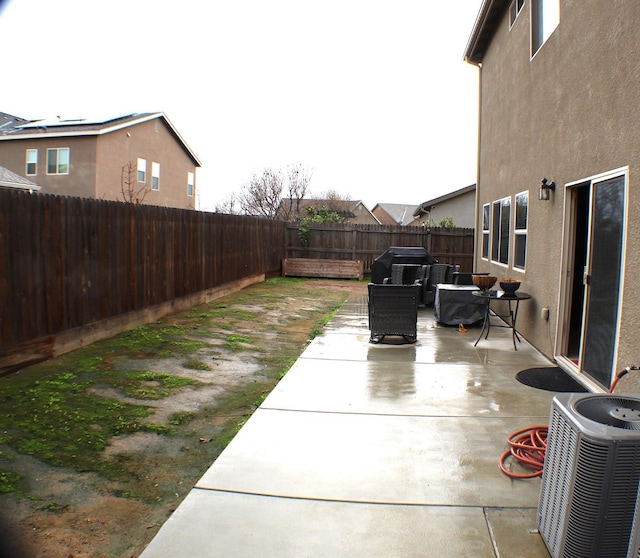 view of patio with central AC unit