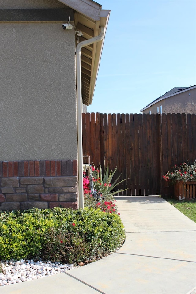 view of side of home with a patio area