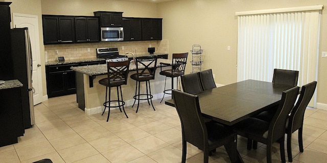 dining room featuring light tile patterned floors