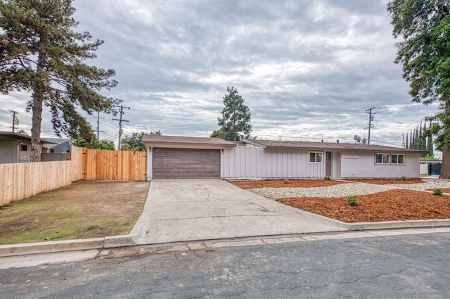 single story home featuring a garage