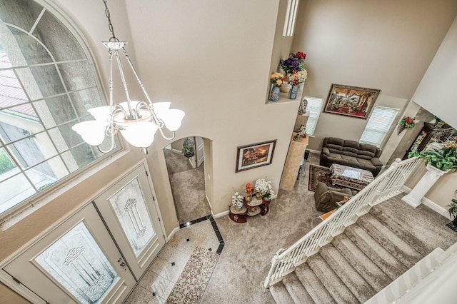 details featuring a chandelier and carpet floors