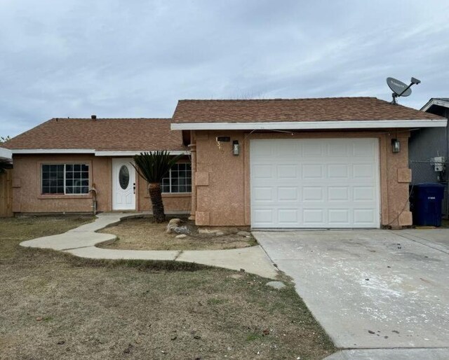 ranch-style house featuring a garage