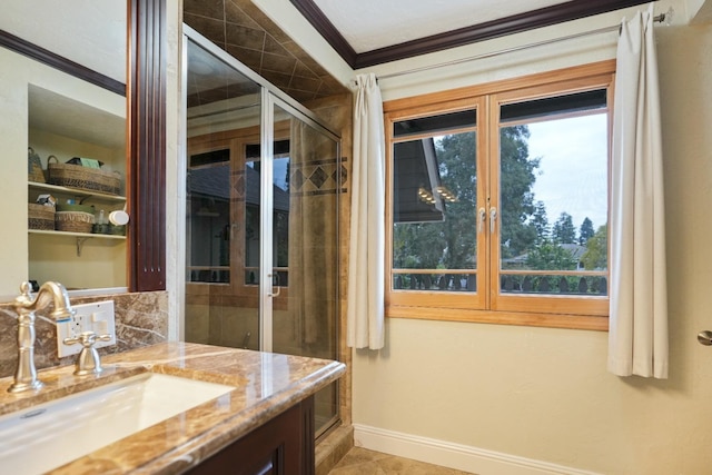 bathroom featuring vanity, tile patterned floors, walk in shower, and ornamental molding