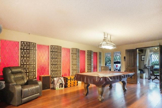 recreation room with hardwood / wood-style flooring and pool table