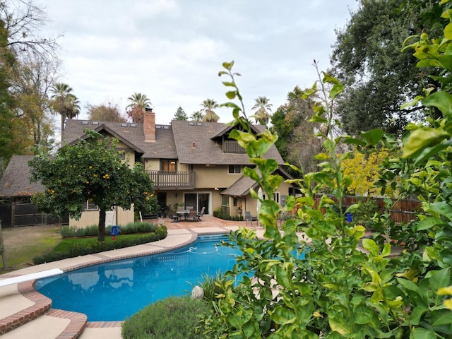 view of swimming pool with a patio