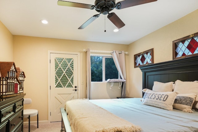 bedroom with light carpet and ceiling fan