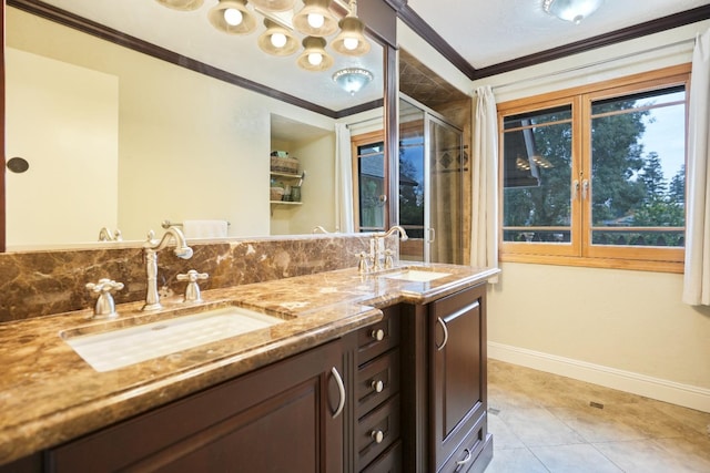 bathroom featuring tile patterned floors, vanity, and crown molding