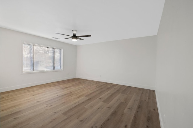 empty room featuring light wood-type flooring and ceiling fan