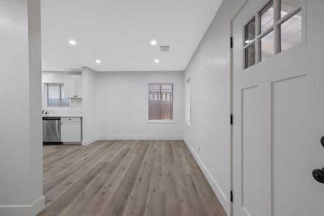 unfurnished living room featuring light wood-type flooring