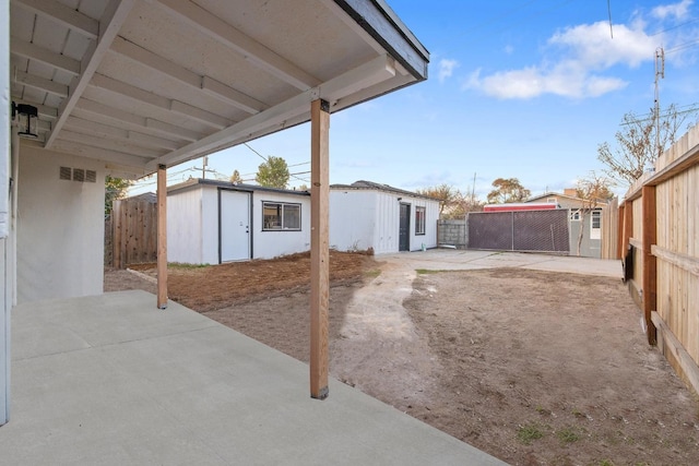 view of patio with a shed