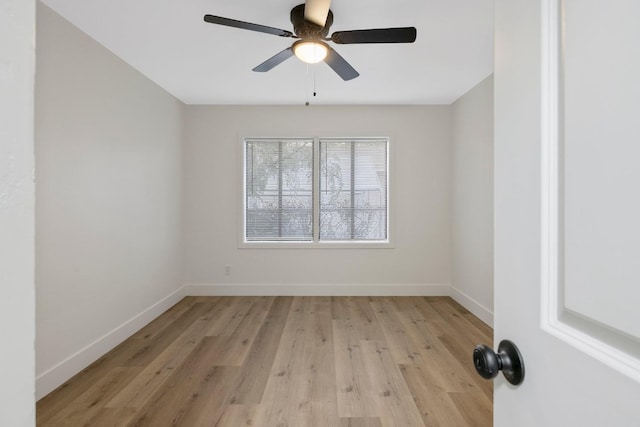 empty room featuring ceiling fan and light hardwood / wood-style flooring