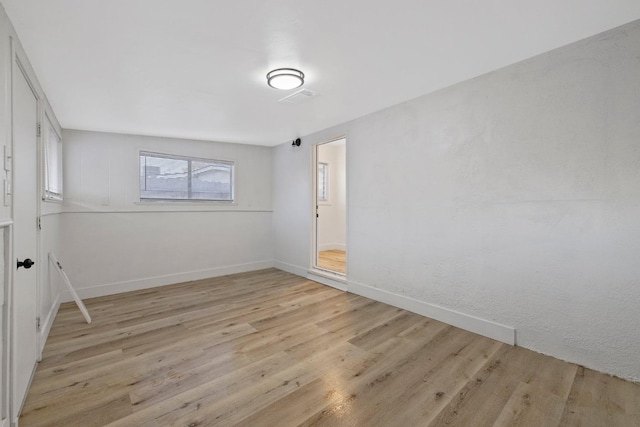 spare room featuring light hardwood / wood-style flooring