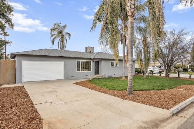 single story home featuring a garage and a front yard