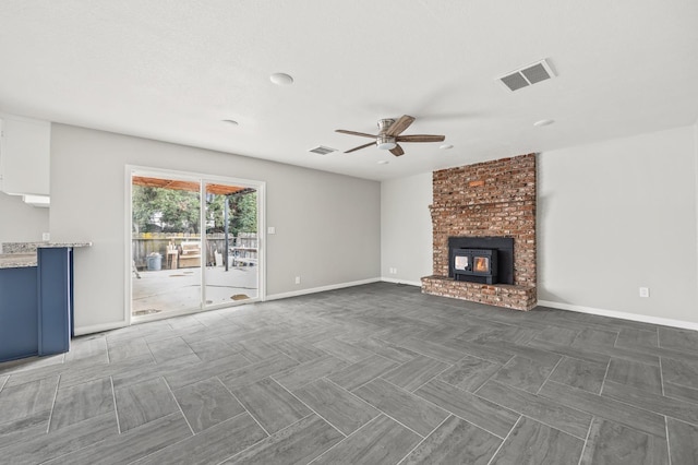 unfurnished living room with ceiling fan