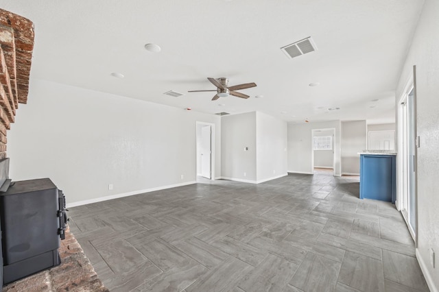 unfurnished living room featuring parquet floors and ceiling fan