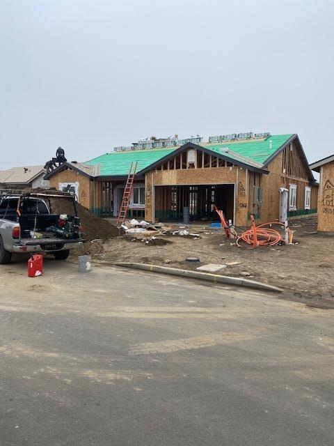 property in mid-construction with a garage