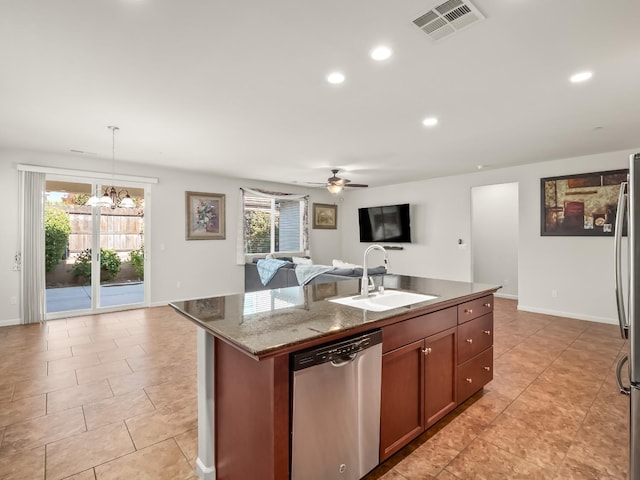 kitchen featuring hanging light fixtures, sink, a healthy amount of sunlight, and appliances with stainless steel finishes