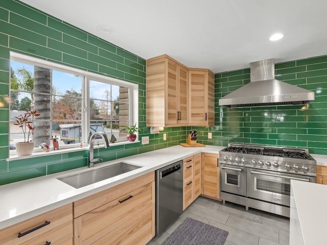 kitchen featuring sink, light brown cabinets, wall chimney exhaust hood, backsplash, and appliances with stainless steel finishes